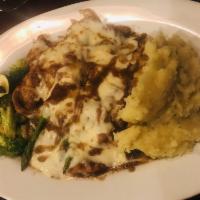 Chicken Brielle · Topped with asparagus, prosciutto and mozzarella in a brown sherry sauce and garlic mashed p...