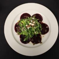 Roasted Beet Salad · Roasted beets topped with organic baby arugula, goat cheese, pine nuts and basil vinaigrette...