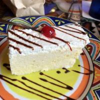 Tres Leches · Traditional cake floating in sweet creamy milks.