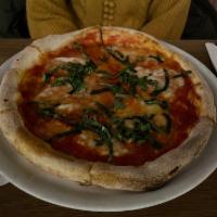 Margherita Pizza · Tomato sauce, Buffalo mozzarella, basil, olive oil, and sea salt.