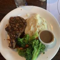 Pork Chop · Generous 12 oz. French bone chop, grilled with cracked black pepper and finished with a red ...