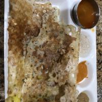 Masala Dosa · Savory crepe filled with mildly spiced mashed potatoes.