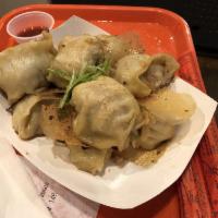Pork Dumpling · Pork and Asian green-stem chives. Choice of 6 or 10 dumplings.