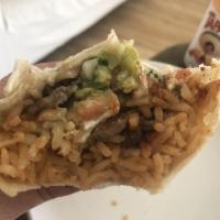 Super Burrito · Meat, beans, cheese, rice, pico de gallo, salsa verde, sour cream and guacamole.
