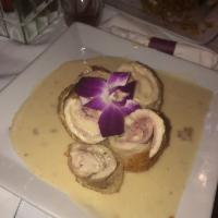 Chicken Cordon Bleu · Breaded Chicken breast stuffed with cheese and ham over our homemade white sauce served with...