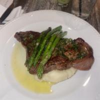 New York Strip Steak · Glazed with Argentinean chimichurri served with roasted potatoes and asparagus.