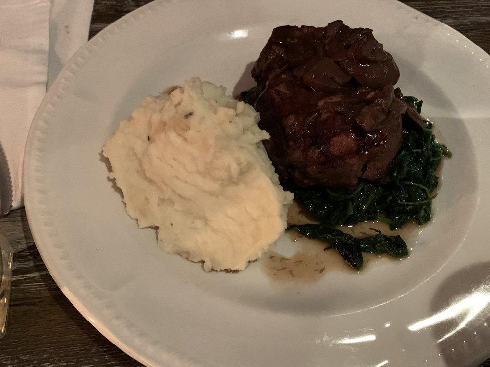 Filet Mignon · Served with green peppercorn sauce, mashed potatoes, and spinach.