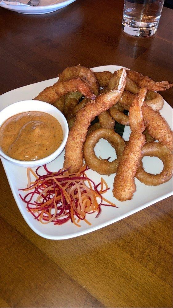Shrimp Tempura · Crispy shrimp and fresh onion rings in a light tempura batter, served with creamy sweet and spicy mayo dipping sauce.