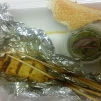 Chicken Satay · Marinated chicken skewered, grilled, and served with peanut sauce and cucumber relish.