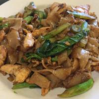 Pad See Eew · Flat rice noodles stir fried with chicken, pork, beef or shrimp, Chinese broccoli and egg in...
