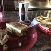 San Diego Chicken Philly Sandwich · Thinly sliced, grilled chicken breast, sauteed bell peppers, onions and cheddar cheese. Serv...