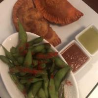 Empanadas · General chicken, roasted poblano corn, red curry chicken, shiitake and queso and Asian pulle...
