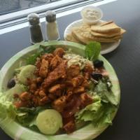 Greek Salad with Chicken · Romaine lettuce, marinated chicken, tomatoes, onions, cucumber, olives and feta cheese.