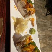 Dragon Roll · Eel and avocado on top of Cali roll with eel sauce. 