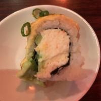 Baked Salmon Roll · Cali rolls topped with baked salmon, spicy mayo and eel sauce. 