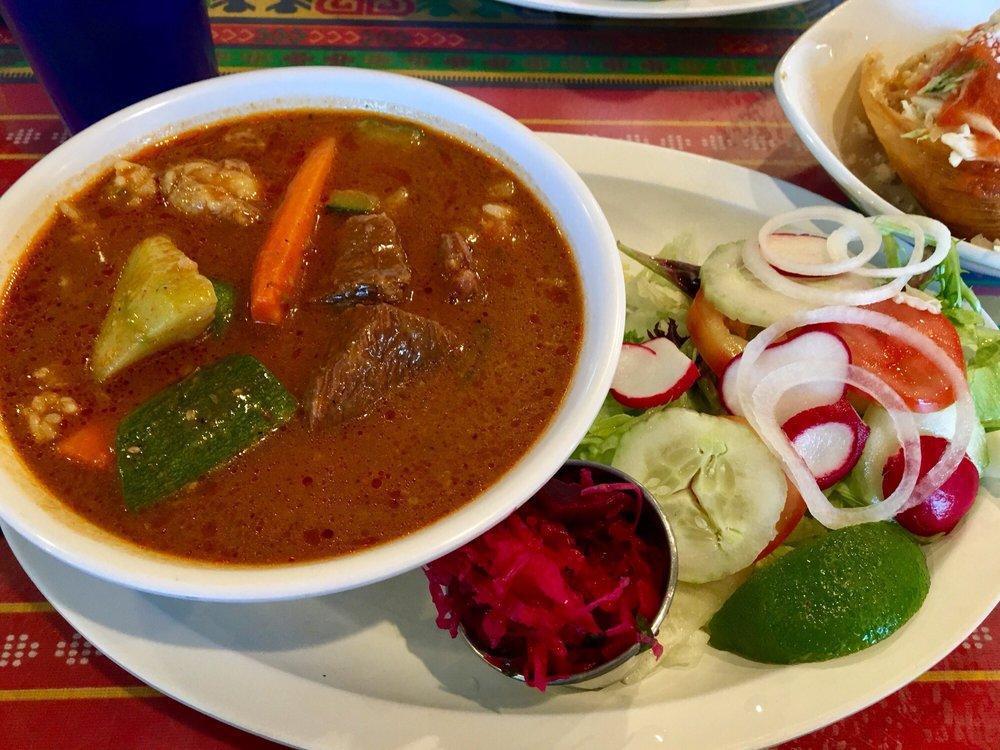 Carne Guisada · Delicious Guatemalan-style beef filet cooked in a homemade sauce with veggies accompanied with beet cabbage salad. Served with rice, beans, salad and homemade tortillas.