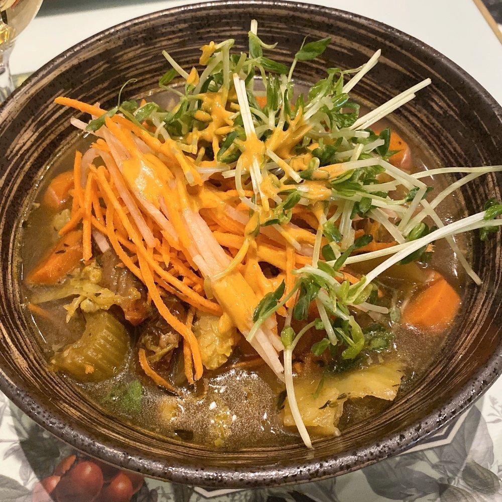 Vegetable Tajine · Quinoa, potato, Moroccan vegetable stew, root vegetables, served with lemon harissa dressing. Contains : onion, garlic, porcini, harissa, cumin, cilantro. Gluten free. Organic.
