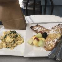 Baked French Toast · Le Bon's signature French toast scented with orange and vanilla, served with fresh fruit and...