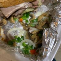Colorado Sandwich · Hot roast beef, green peppers, onions, mushrooms, Swiss cheese, and house dressing on rye br...