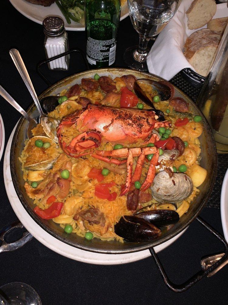 Paella Marinera · Saffron, calasparra rice, clams, mussels, prawns, calamari, scallops, chicken, shrimp and chorizo.