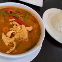 Panang Curry · Chicken or tofu, blended with coconut milk. Comes with green and red bell peppers, bamboo sh...