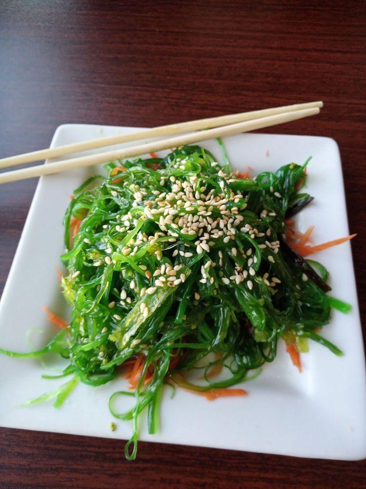 Seaweed Salad · Served on a bed of shredded carrots and topped with sesame seeds. Vegan.