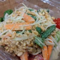 Papaya Salad · A popular Thai 4-flavors spicy salad made with raw papaya, carrots, string beans, tomato and...