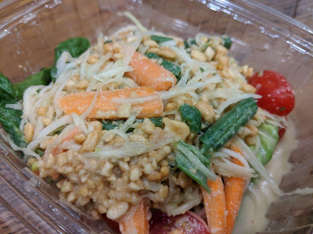 Papaya Salad · A popular Thai 4-flavors spicy salad made with raw papaya, carrots, string beans, tomato and peanuts, mixed with lime juice and fish sauce, palm sugar and chilies. Contains peanut. Spicy. Gluten free.