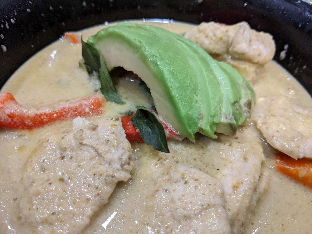 Emerald Green Curry · Emerald green curry. The most famous Thai local curry, green curry paste blended in coconut cream, basil, avocado and bell pepper. Served with a choice of jasmine rice or steamed rice noodles. Spicy. Gluten free.