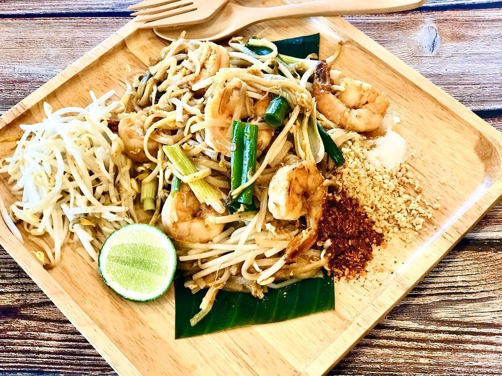 Pad Thai · Stir-fried rice noodles with choice of meat, egg, bean sprouts, scallions with crushed peanut.