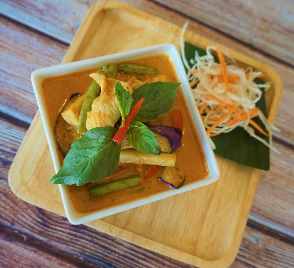 Red Curry · Spicy red curry in coconut milk with choice of meat, green beans, bamboo shoots, eggplants, bell peppers and basil.