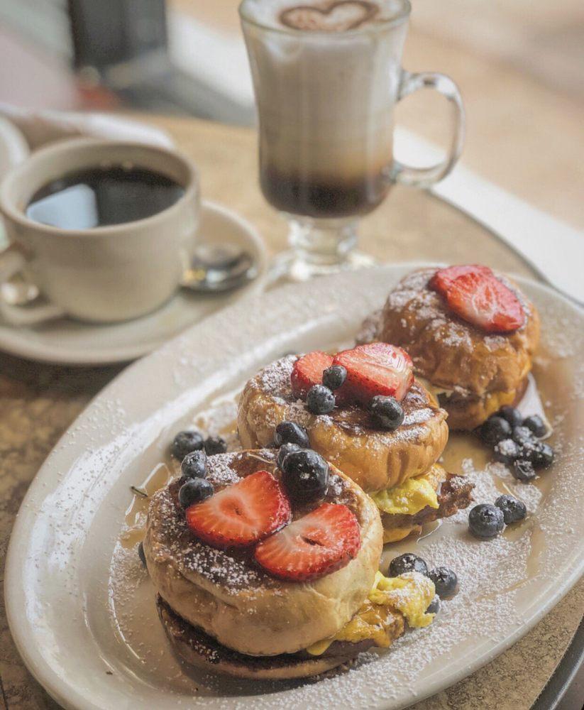 French Toast Sliders · Three of our delicious mini French Toast Sliders with Egg, Sausage & Cheddar Cheese. Drizzled with Maple Syrup, Powdered Sugar & topped with Fresh Blueberries for the finishing touch!