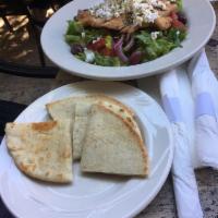 Greek Salad · Romaine lettuce, feta cheese, green peepers, tomatoes, onions, Kalamata olives and cucumbers...