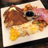 French Toast · thick sliced french toast topped with maple syrup served with two egs, home fries, and your ...
