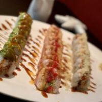 Crunch Munch Roll · Spicy crab inside, cooked shrimp on top with tempura flakes with eel sauce.
