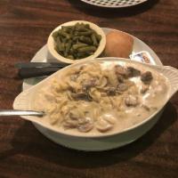 Beef Stroganoff · A classic with tender beef, mushrooms and a creamy sauce with egg noodles. Served with 1 reg...