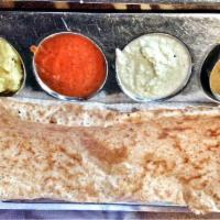 Masala Dosa · A large Indian rice crepe with a delicious stuffing of seasoned potatoes and onions.