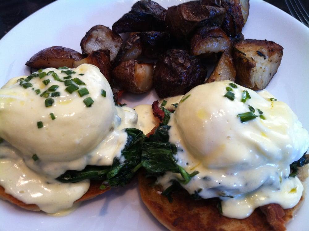 Eggs Benedict · poached eggs, toasted english muffin, black forest ham, hollandaise sauce, breakfast potatoes