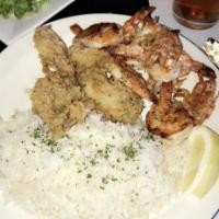 Fried Shrimp · Lightly dusted in seasoned flour and served with lemon rice and a light drizzle of lemon and...