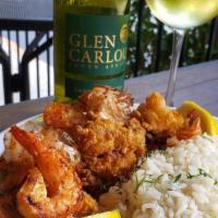 Fried Oysters · Lightly dusted with seasoned flour, fried and served over a mound of lemon rice with lots of...