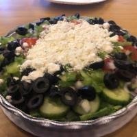 Greek Salad · Lettuce, tomatoes, cucumbers, onions, green peppers, olives and feta cheese.
