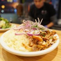 Chicken Shawarma · Thinly sliced chicken cooked on a slow rotisserie Served with Rice, Salad, Hummus and Pita b...