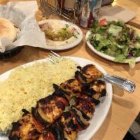 Chicken Kabob · Two Skewers marinated Chicken Breast Served with Rice, Salad, Hummus and Pita bread