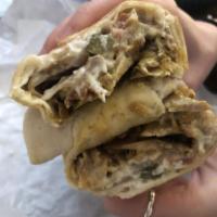 Chicken Shawarma Sandwich · Thinly sliced chicken breast, cooked on a slow rotisserie, served with tomatoes, pickles and...