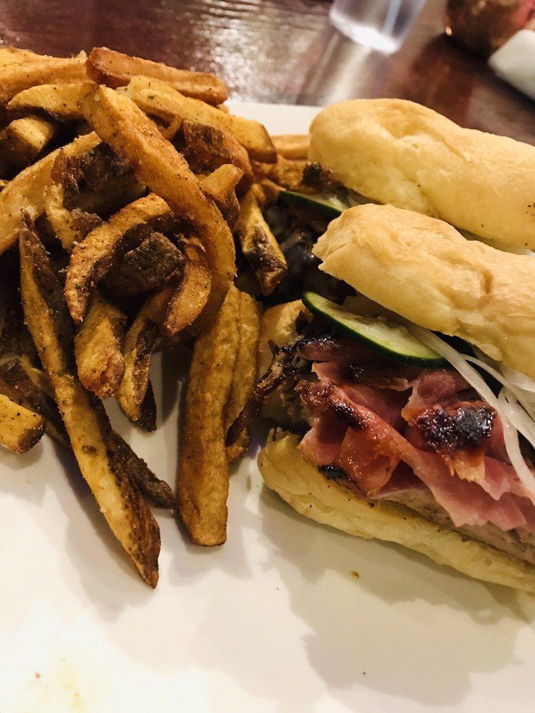 Cubano Sandwich · Pulled pork, ham, Swiss, pickled cucumbers and onions, mustard sauce.