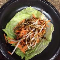 Asian Lettuce Wraps · 4 pieces. Crisp lettuce with minced chicken and vegetables.