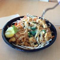 Chicken Pad Thai · Rice noodles in tangy pad Thai sauce with green onions, carrots, egg, peanuts, and bean spro...