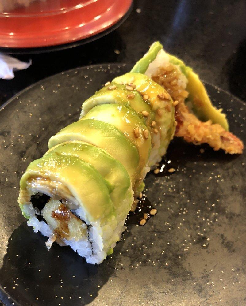 Green Dragon Roll · Shrimp tempura inside, avocado on top, eel sauce and sesame seed.