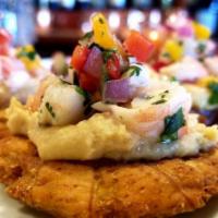 Ceviche · Briefly marinated fish in fresh lime juice and served with potatoes, Peruvian corn, red onio...