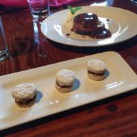 Alfajores · Shortbread sandwich cookies filled with rich manjar blanco and covered with powdered sugar.